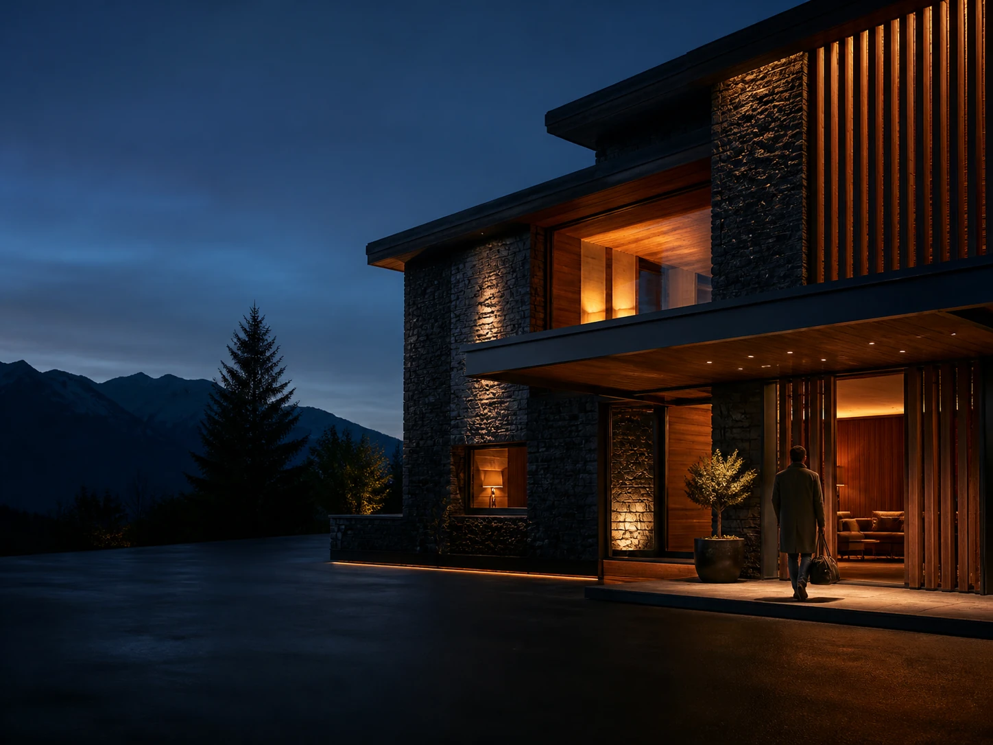 Boutiquehotel aus Naturstein und Holz bei früher Abendstimmung